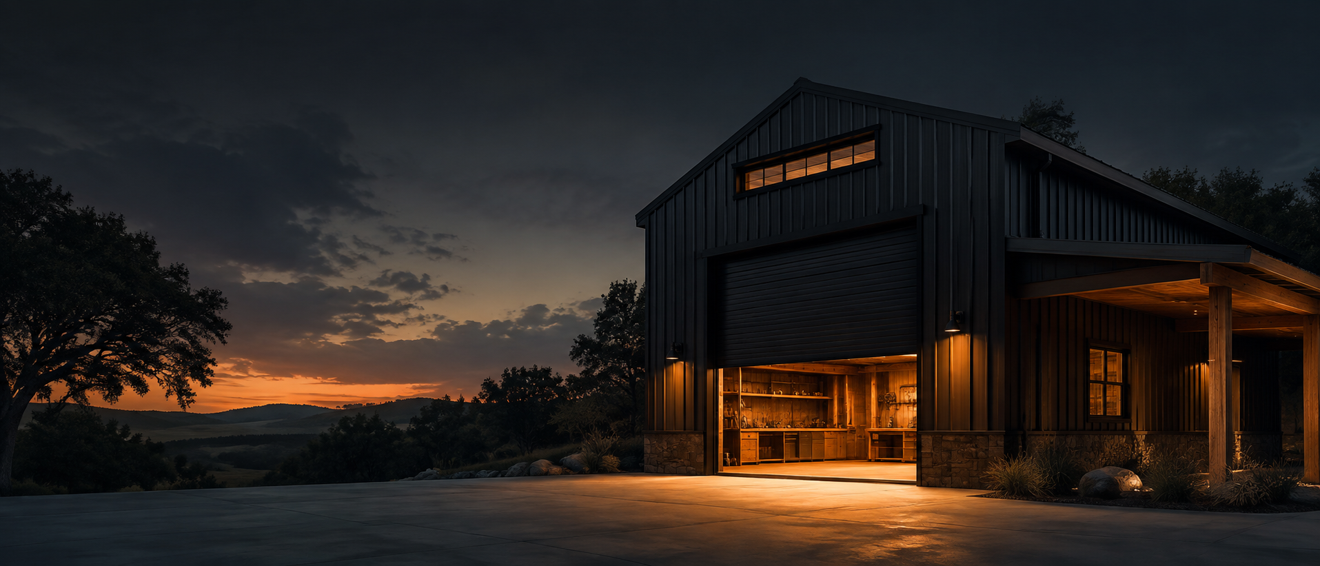 Modern workshop building at dusk with warm interior light